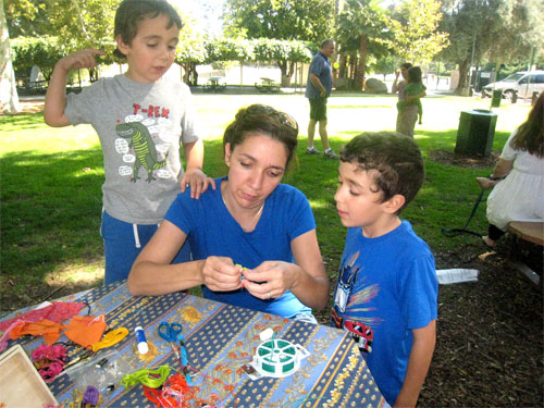 Adam & David direct Lilach in her Worry Doll creations