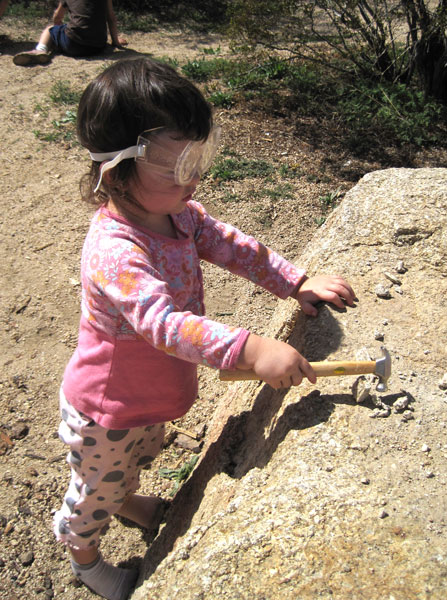 Safety Goggles and Small hammers in hand. The kids explore this differences between quartz, granite and other stones found around the campsite as well as get a bit of frustration out in a healthy manner.