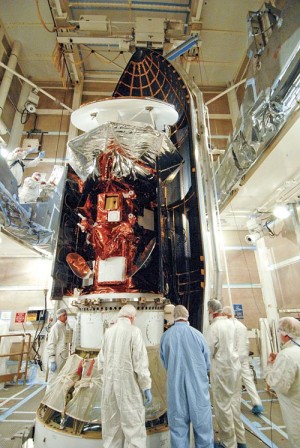 Aquarius Satellite being installed into ULA Delta II Rocket head - from Lompoc Record paper